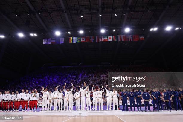Gold medalists of Team France , Silver medalists of Team Poland and Bronze medalists of Team United States celebrate on the podium during the...