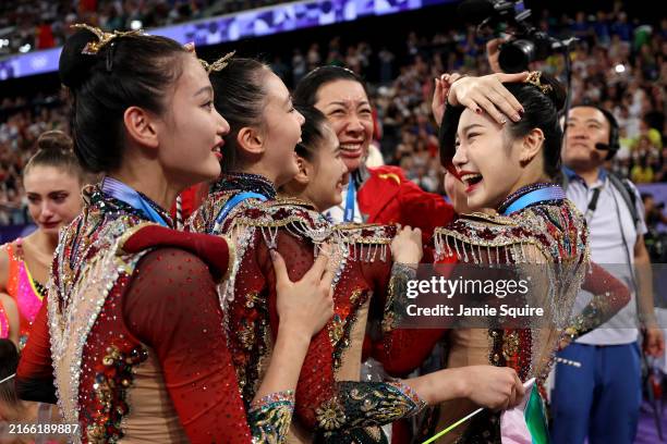Gold medalists Team People's Republic of China celebrates after competing in the Rhythmic Gymnastics Group All-Around Final on day fifteen of the...
