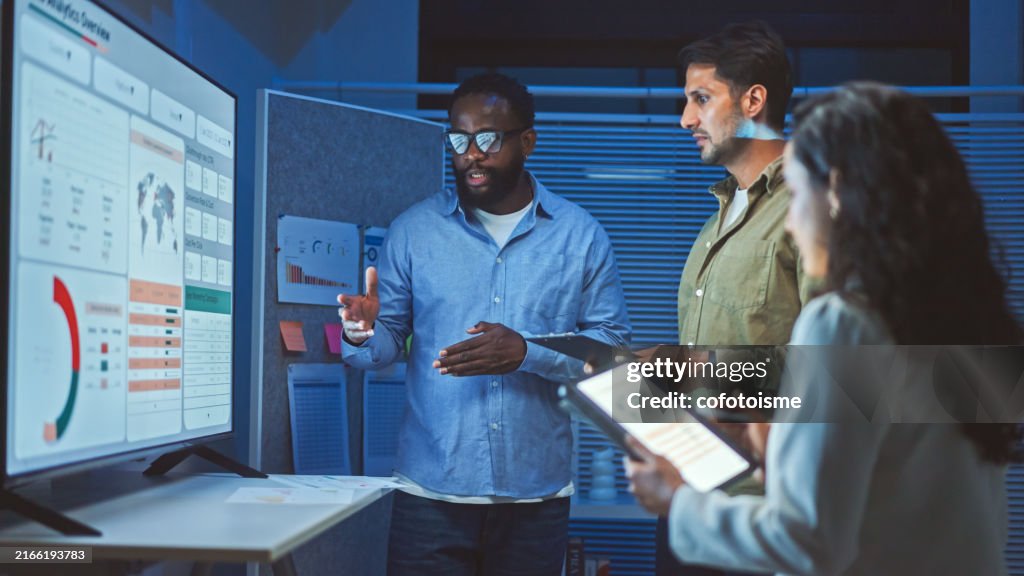 Data analytics team meeting at night.