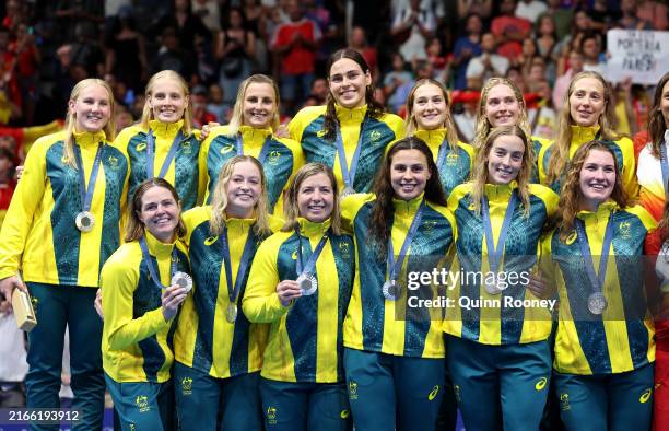 Silver Medalists of Team Australia pose on the podium during the Women’s Water Polo medal ceremony after the Women's Gold Medal match between Team...