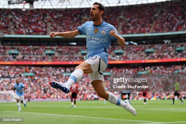 Bernardo Silva of Manchester City celebrates scoring his team's first goal during the 2024 FA Community Shield match between Manchester United and...