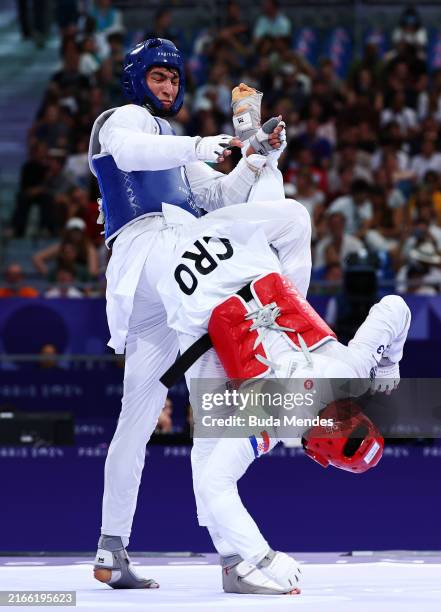 Ivan Sapina of Team Croatia and Arian Salimi of Team Islamic Republic of Iran compete during a Men's +80kg Semifinal match on day fifteen of the...