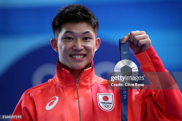 Silver Medalist Rikuto Tamai of Team Japan poses following the Diving medal ceremony after the Men's 10m Platform Final on day fifteen of the Olympic...