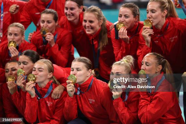 Members of Team Norway pose with their medal during the medal ceremony on day fifteen of the Olympic Games Paris 2024 at Stade Pierre Mauroy on...