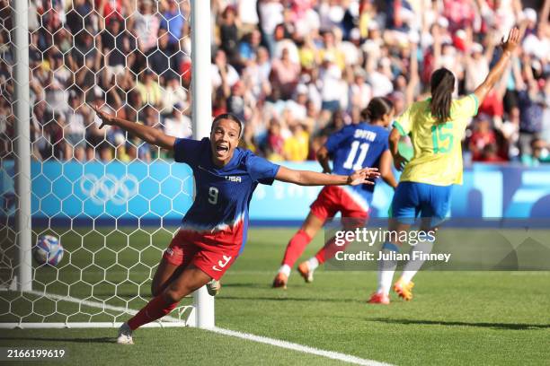 Mallory Swanson of Team United States celebrates scoring her team's first goal during the Women's Gold Medal match between Brazil and United States...