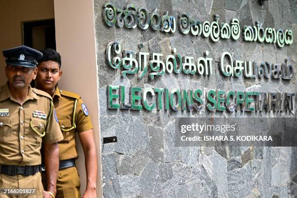 Police personnel stand guard as presidential candidates file nomination papers for the upcoming presidential elections at the Election Commission...