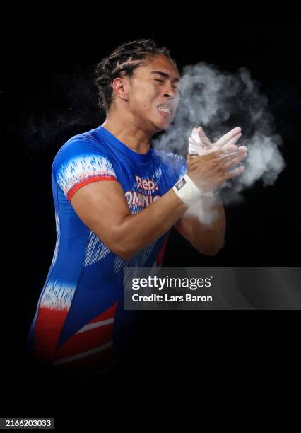 Yedelina Mejia Peguero of Team Dominican Republic reacts after performing a Snatch in the Weightlifting Women's 81kg on day fifteen of the Olympic...