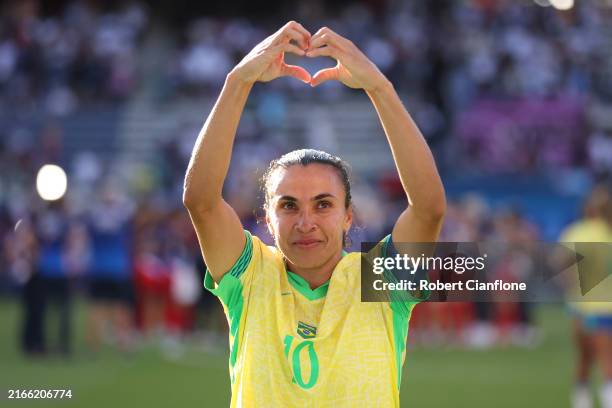 Marta of Team Brazil acknowledges the fans after the team's defeat in the Women's Gold Medal match between Brazil and United States of America during...