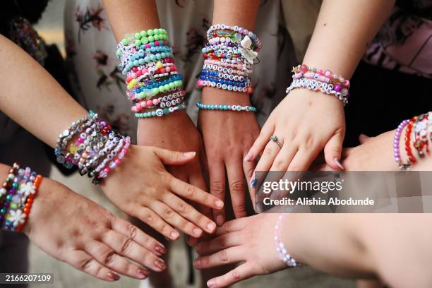 Swifties', Taylor Swift fans, display friendship bracelets at Wembley Stadium on August 15, 2024 in London, England. Following the cancellation of...