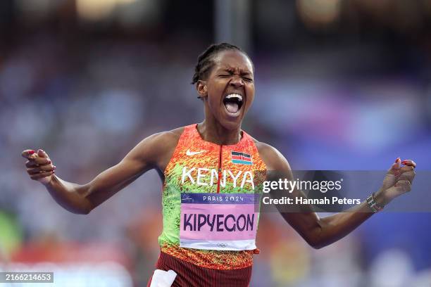 Faith Kipyegon of Team Kenya celebrates winning the Gold medal and setting a new Olympic record in the Women's 1500m Final on day fifteen of the...