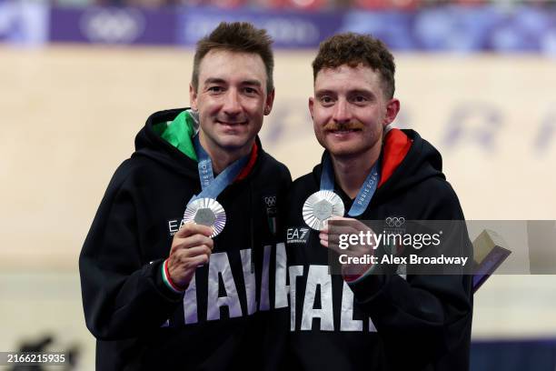 Silver medalists Elia Viviani and Simone Consonni of Team Italy celebrate on the podium after the Men's Madison Final on day fifteen of the Olympic...