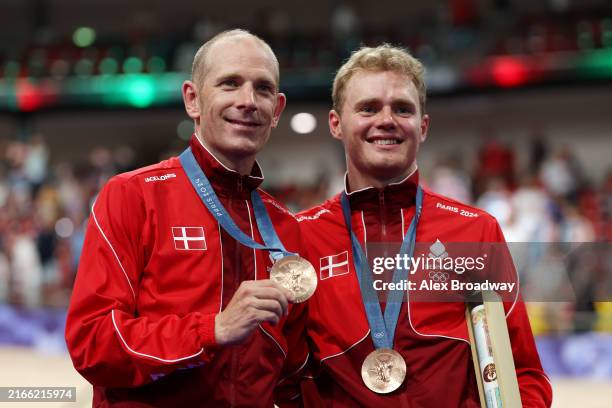 Bronze medalist Michael Moerkoev and Niklas Larsen of Team Denmark pose on the podium after the Men's Madison Final on day fifteen of the Olympic...