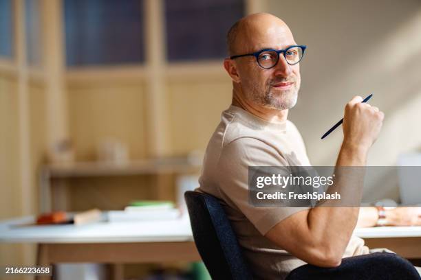 confident professional man working in modern office - beige stock pictures, royalty-free photos & images