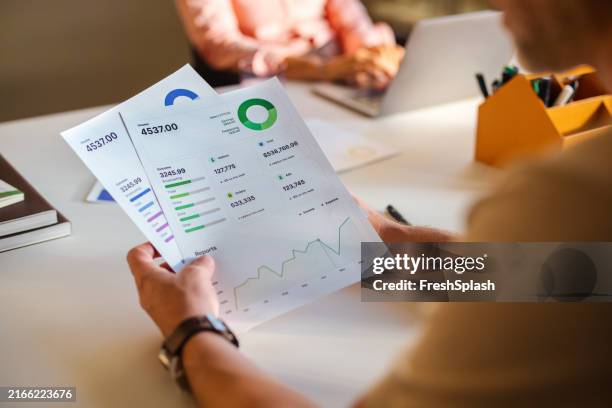 business analysis and financial report review in office - financial report stock pictures, royalty-free photos & images