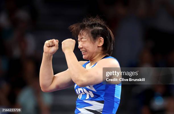 Sakura Motoki of Team Japan celebrates after winning a Women's Freestyle 62kg gold medal match against Iryna Koliadenko of Team Ukraine on day...
