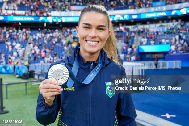 Tamires of Brazil poses with ther silver medal after the Women's Gold Medal match between Brazil and United States of America during the Olympic...