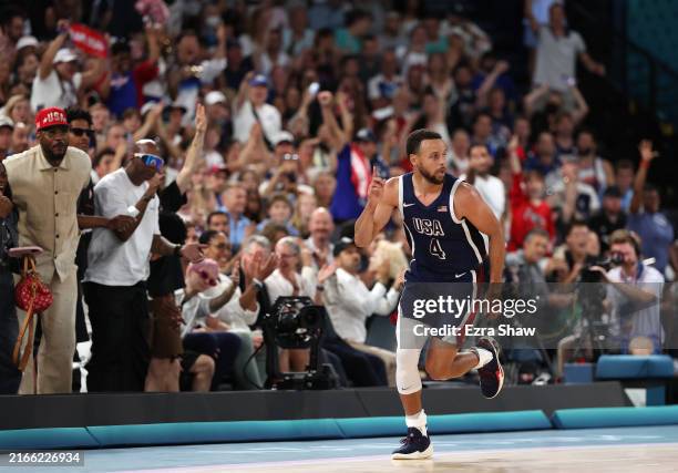 Stephen Curry of Team United States reacts after a three point basket during the Men's Gold Medal game between Team France and Team United States on...