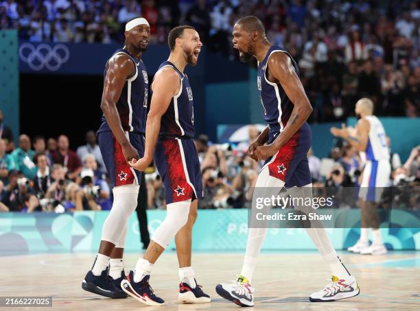 Bam Adebayo, Stephen Curry, and Kevin Durant of Team United States react during the Men's Gold Medal game between Team France and Team United States...