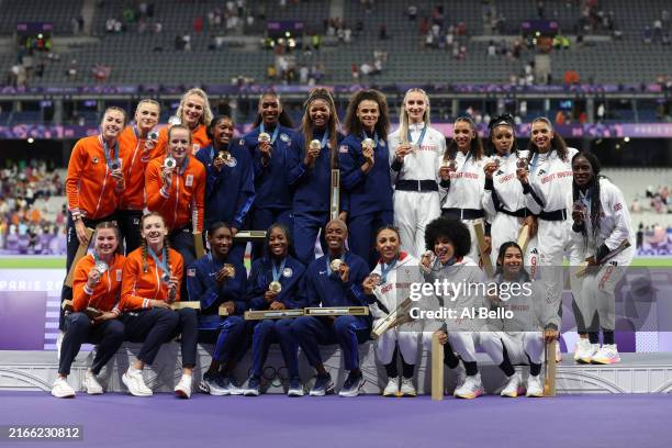 Gold medalists of Team Unites States , Silver Netherlands and Bronze medalists Great Britain celebrate on the podium during the Women's 4 x 400m...
