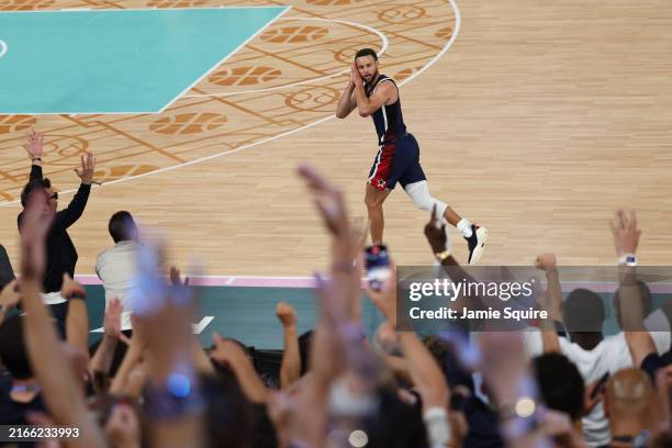 Stephen Curry of Team United States reacts after a three point basket during the Men's Gold Medal game between Team France and Team United States on...
