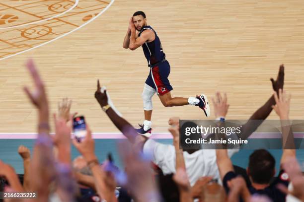 Stephen Curry of Team United States reacts after a three point basket during the Men's Gold Medal game between Team France and Team United States on...