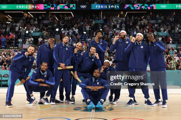 Gold medalists Team United States pose for a photo during the Men's basketball medal ceremony on day fifteen of the Olympic Games Paris 2024 at Bercy...