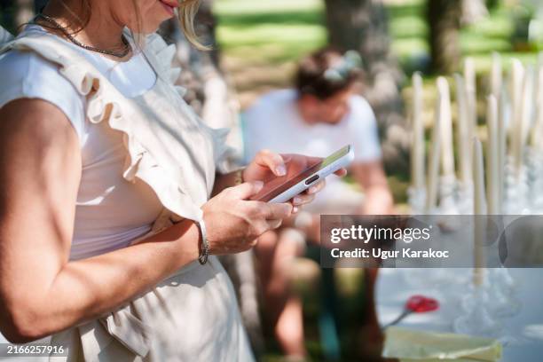 event team member is using mobile phone - wedding alter stock pictures, royalty-free photos & images