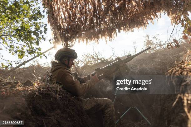 Ukrainian soldier fires a machine gun at Russian drones in the direction of Marinka, Ukraine on 15 August 2024.