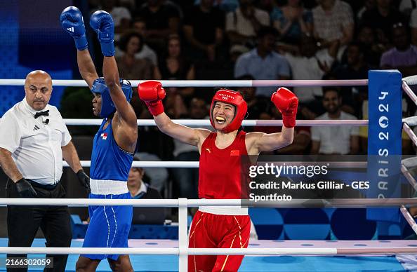 Li Quan Boxing Gold medalist Li Qian of Team China celebrates victory against silver ...