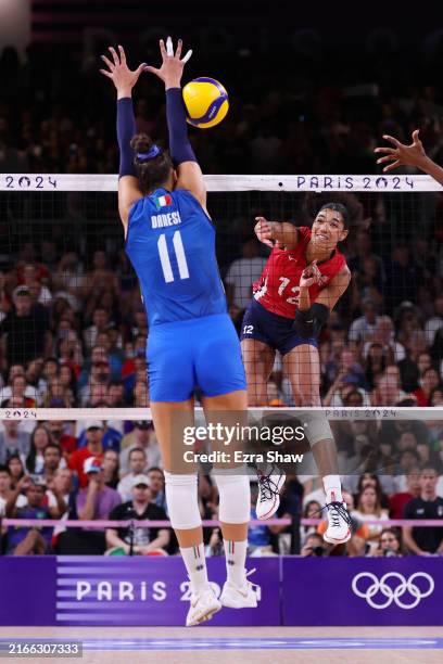 Jordan Thompson of Team United States attacks the ball as Anna Danesi of Team Italy defends during the Women's Gold Medal match between Team United...