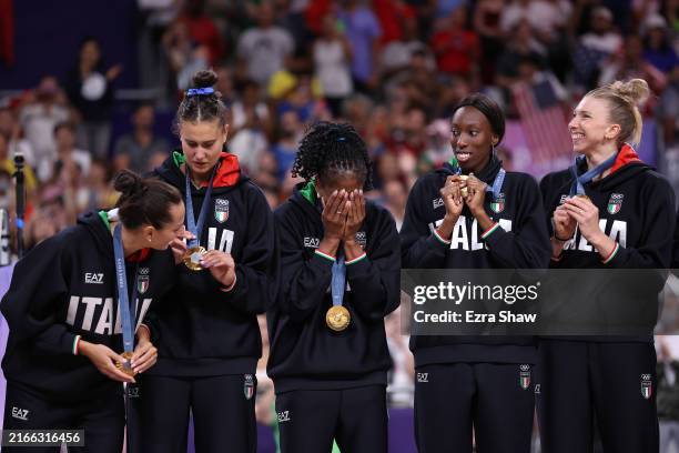 Gold medalists Team Italy celebrate on the podium during the Medal Ceremony after the Women's Gold Medal match between Team United States and Team...