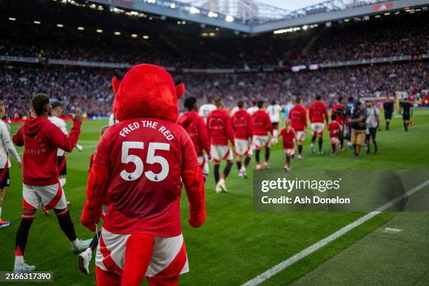 Manchester United mascot Fred the Red looks on prior to the Premier League match between Manchester United FC and Fulham FC at Old Trafford on August...
