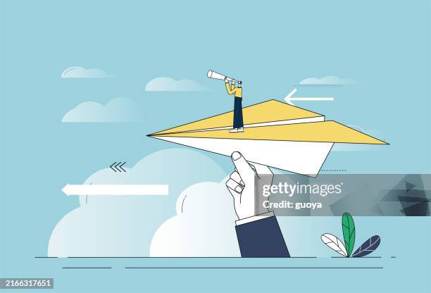 the giant is holding a paper airplane and the white-collar worker is standing on the paper airplane holding a telescope. - paper aeroplane stock illustrations