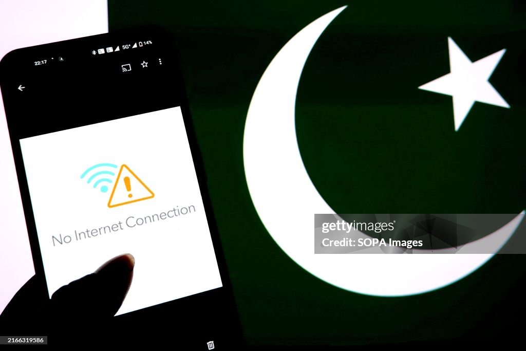 In this photo illustration, a No internet connection seen...