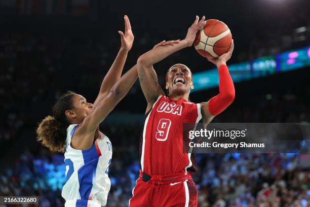 Ja Wilson of Team United States shoots over Marieme Badiane of Team France during the Women's Gold Medal game between Team France and Team United...