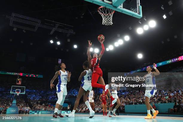 Ja Wilson of Team United States shoots over Valeriane Ayayi of Team France during the Women's Gold Medal game between Team France and Team United...
