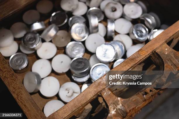 drawer filled with tea light candles - tealight stock pictures, royalty-free photos & images