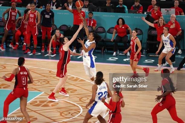 Gabby Williams of Team France shoots a last second basket over Breanna Stewart of Team United States during the Women's Gold Medal game between Team...