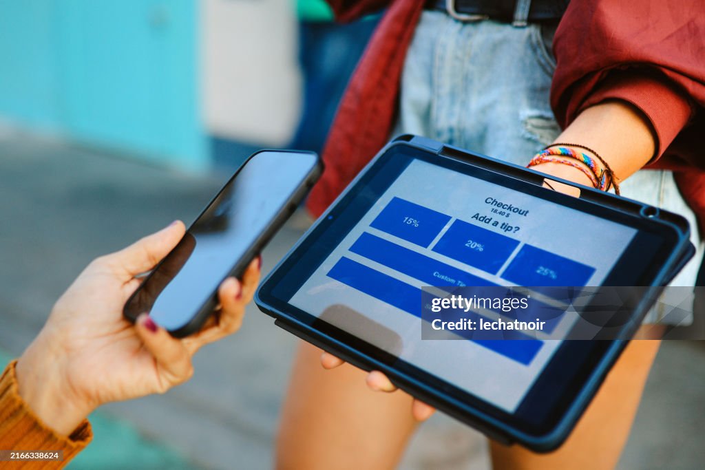 Adding tip via digital tablet payment app in LA, Calilfornia