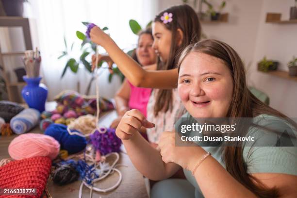 mother teaches two daughters to knit - art and craft stock pictures, royalty-free photos & images