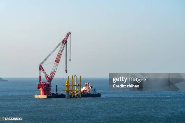 offshore wind turbines under construction - offshore wind turbine installation stock pictures, royalty-free photos & images