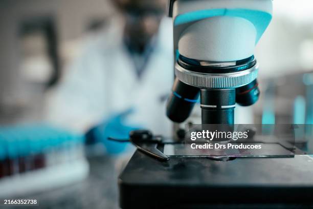 detail of a microscope in the laboratory - microscoop stockfoto's en -beelden