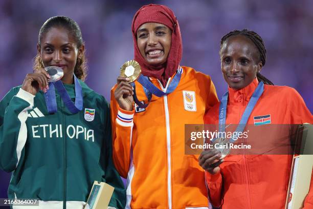 Gold medalist Sifan Hassan of Team Netherlands , Silver medalist Tigst Assefa of Team Ethiopia and Bronze medalist Hellen Obiri of Team Kenya...