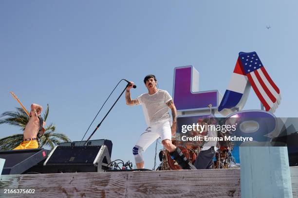 In this image released on August 11, Flea, Anthony Kiedis, Chad Smith, and John Frusciante of Red Hot Chili Peppers perform at the LA28 Olympic...