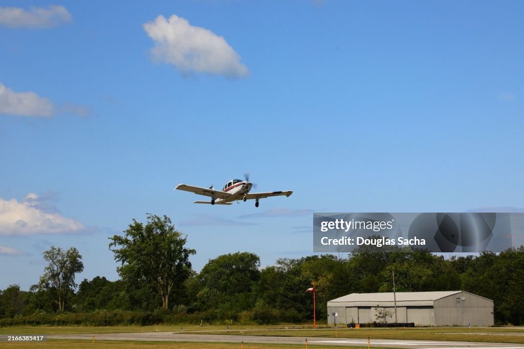 Departing single prop aircraft on a blue sky - airplane flight