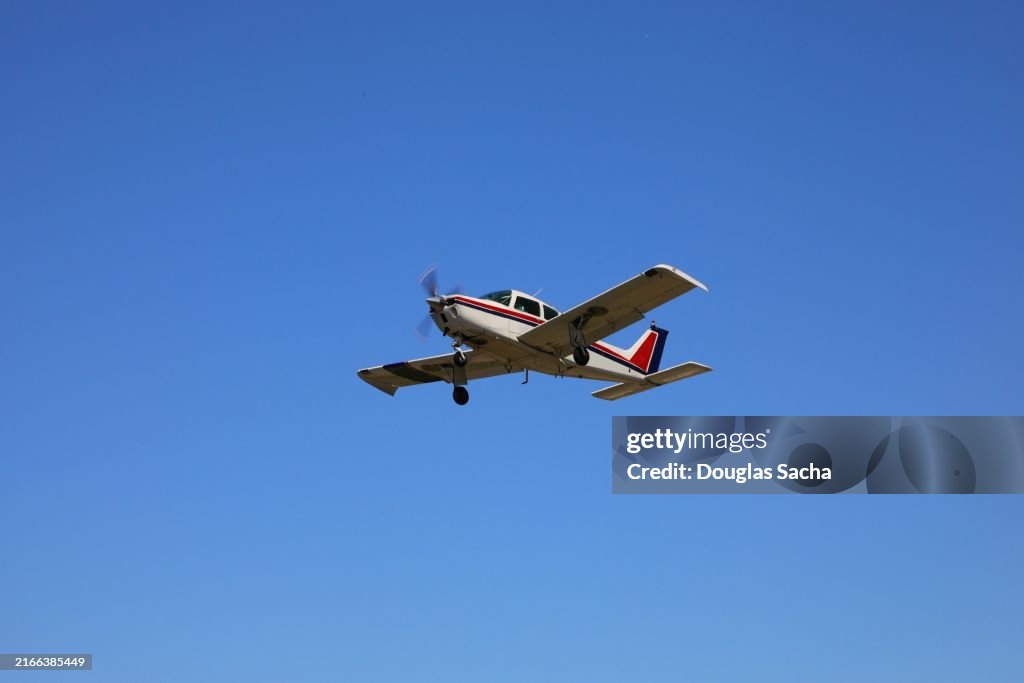 Departing single prop aircraft on a clear sky