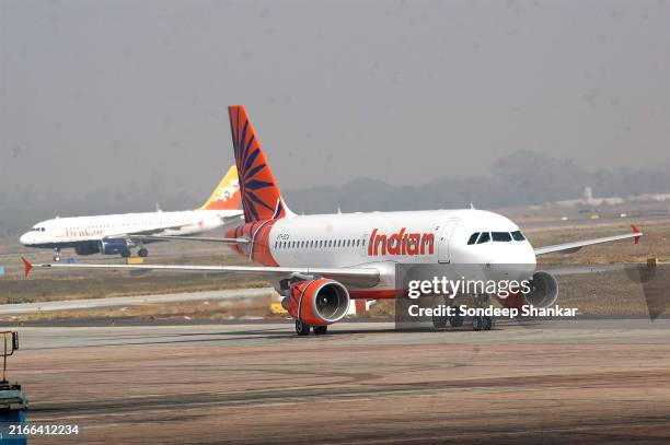 Newly acquired Airbus A - 319, aircraft on a lease by Indian Airlines arrives at the Indira Gandhi International Airport in New Delhi on Wednesday,...