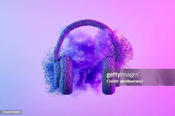 headphones with particles on neon lighting purple background, minimal music concept - auscultador equipamento áudio imagens e fotografias de stock