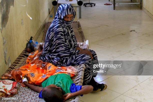 Child suffering from cholera receives treatment at a rural isolation centre in Wad Al-Hilu in Kassala state in eastern Sudan, on August 17, 2024....