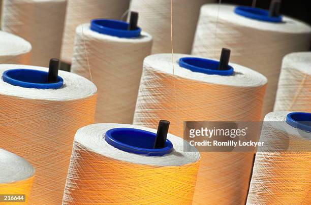 bolts of thread at textile industry in france - fibre textile bildbanksfoton och bilder